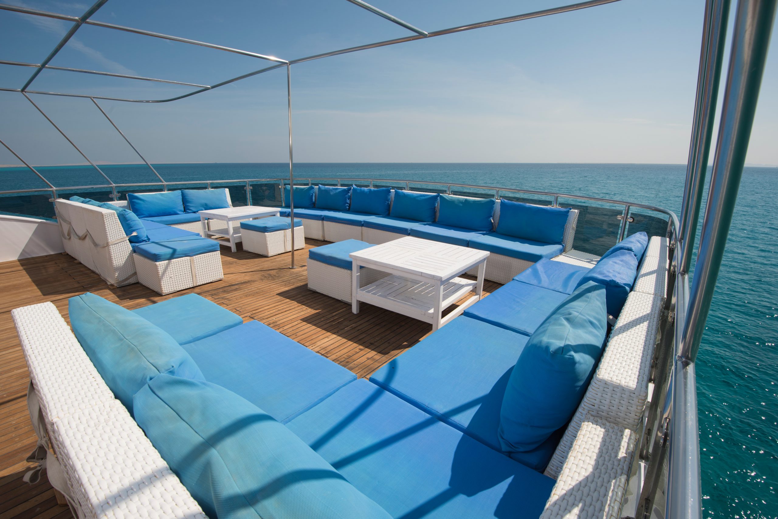 Table and chairs on deck of a luxury motor yacht